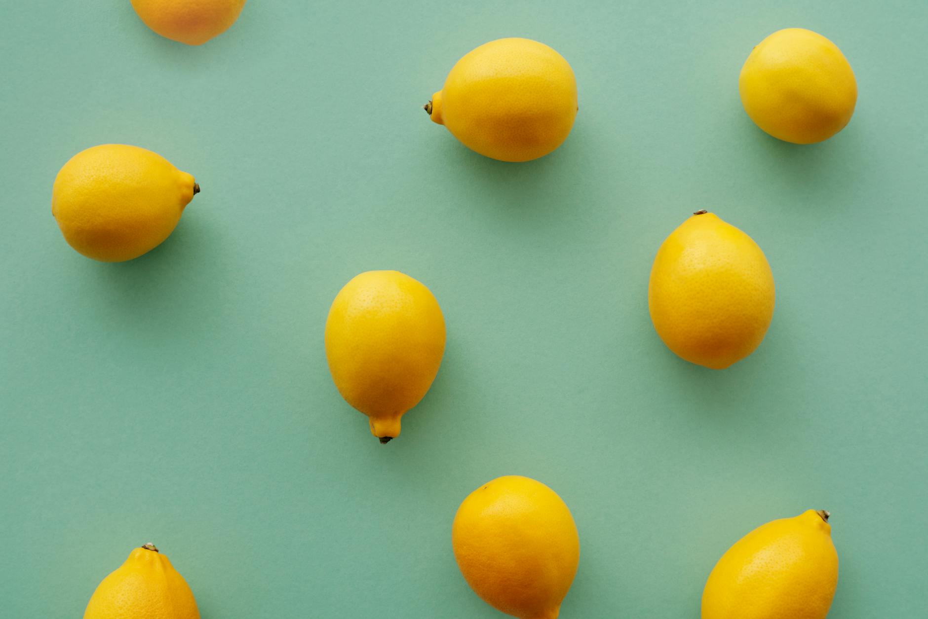 Bright yellow lemons on a pastel green background, symbolizing fresh solutions to medication-related pleasure challenges